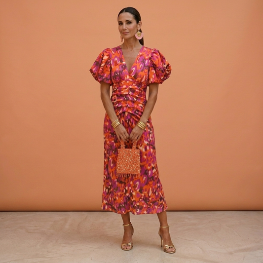 Daniela: Vestido con escote en V y mangas abullonadas en naranja/violeta