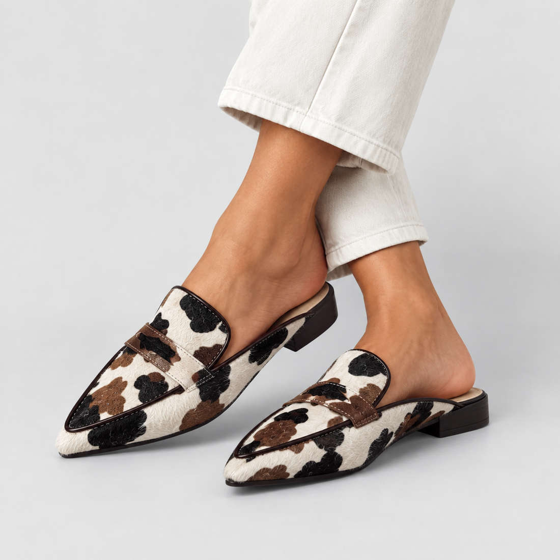 Desirée | Mocasines destalonados con estampado de vaca