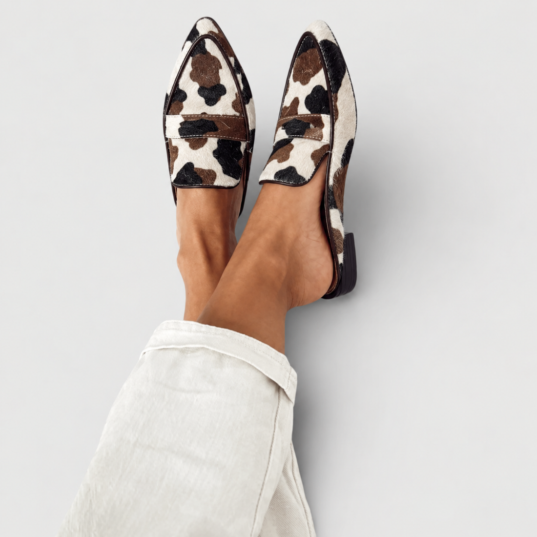 Desirée | Mocasines destalonados con estampado de vaca